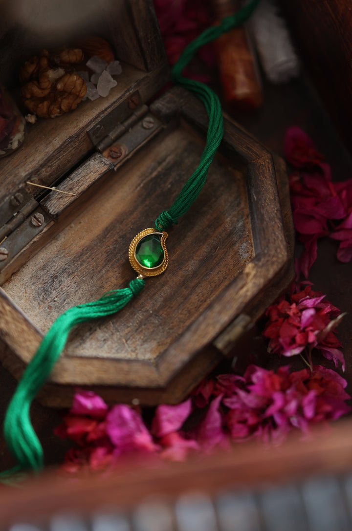 Prasit Gold Plated Emerald Rakhi