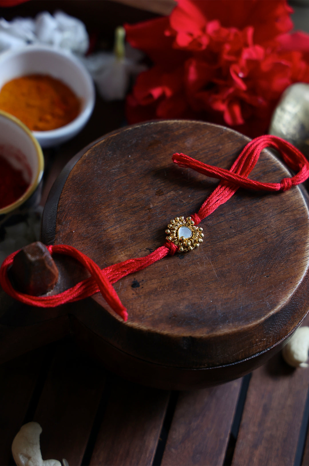 Drishyam Red Gold Plated Pearl Rakhi